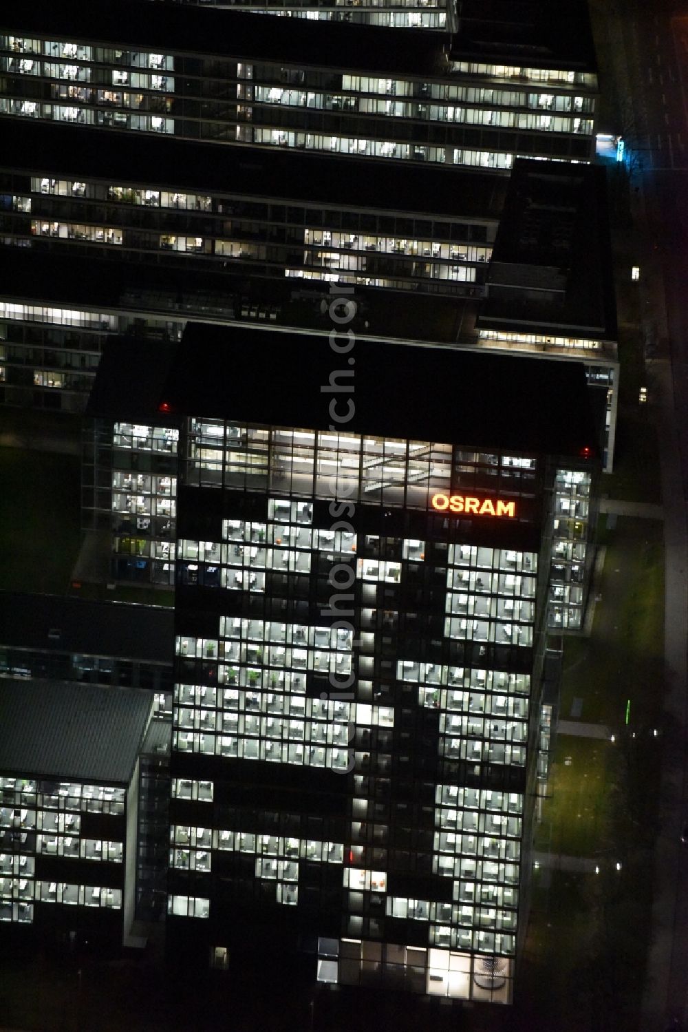 München at night from the bird perspective: Night lighting administration building of the company of OSRAM GmbH on Marcel-Breuer-Strasse in the district Schwabing-Freimann in Munich in the state Bavaria, Germany