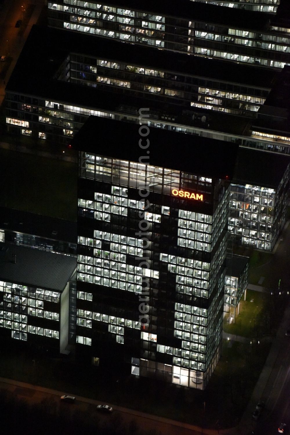 Aerial photograph at night München - Night lighting administration building of the company of OSRAM GmbH on Marcel-Breuer-Strasse in the district Schwabing-Freimann in Munich in the state Bavaria, Germany