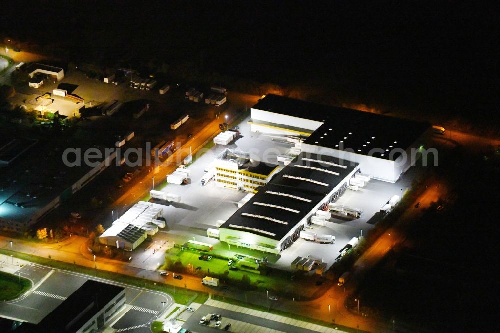 Radeburg at night from above - Night lighting freight forwarding building a logistics and transport company on Gottfried-Schenker-Strasse in the district Berbisdorf in Radeburg in the state Saxony, Germany