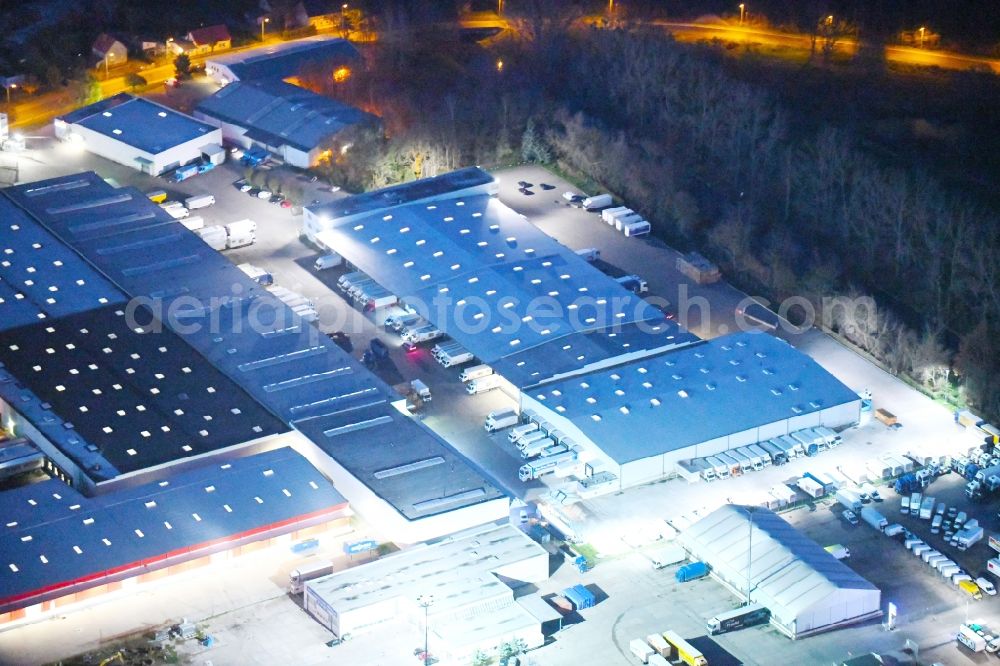 Potsdam at night from above - Night lighting Freight forwarding building a logistics and transport company Krage Potsdam GmbH Am Buchhorst in Potsdam in the state Brandenburg