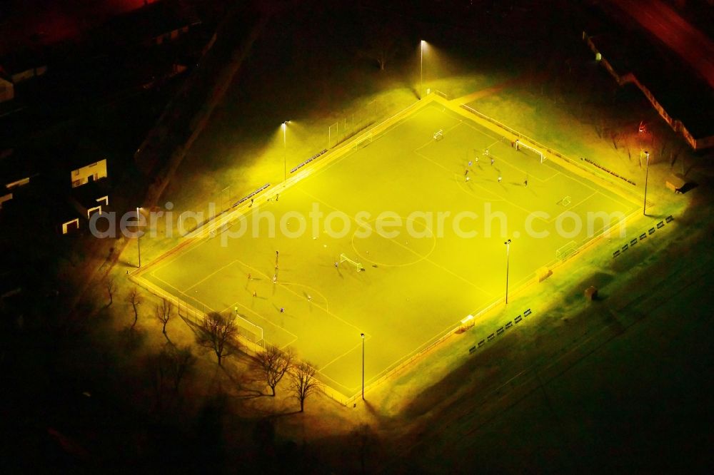 Aerial image at night Brandenburg an der Havel - Night lighting sports grounds and football pitch of FC Borussia Brandenburg e.V. on Massowburg in Brandenburg an der Havel in the state Brandenburg, Germany