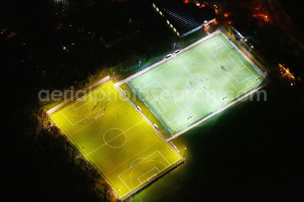 Aerial photograph at night Berlin - Night lighting Sports grounds and football pitch Hubertus-Sportplatz on Wangenheimstrasse in the district Wilmersdorf in Berlin, Germany