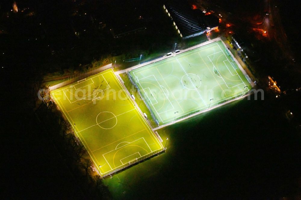 Aerial image at night Berlin - Night lighting Sports grounds and football pitch Hubertus-Sportplatz on Wangenheimstrasse in the district Wilmersdorf in Berlin, Germany