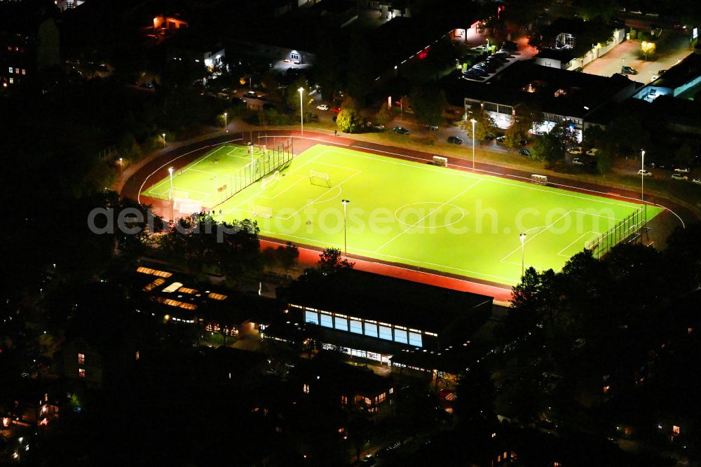 Berlin at night from above - Night lighting sports grounds and football pitch Sochos Sportplatz on street Lessingstrasse in the district Steglitz in Berlin, Germany