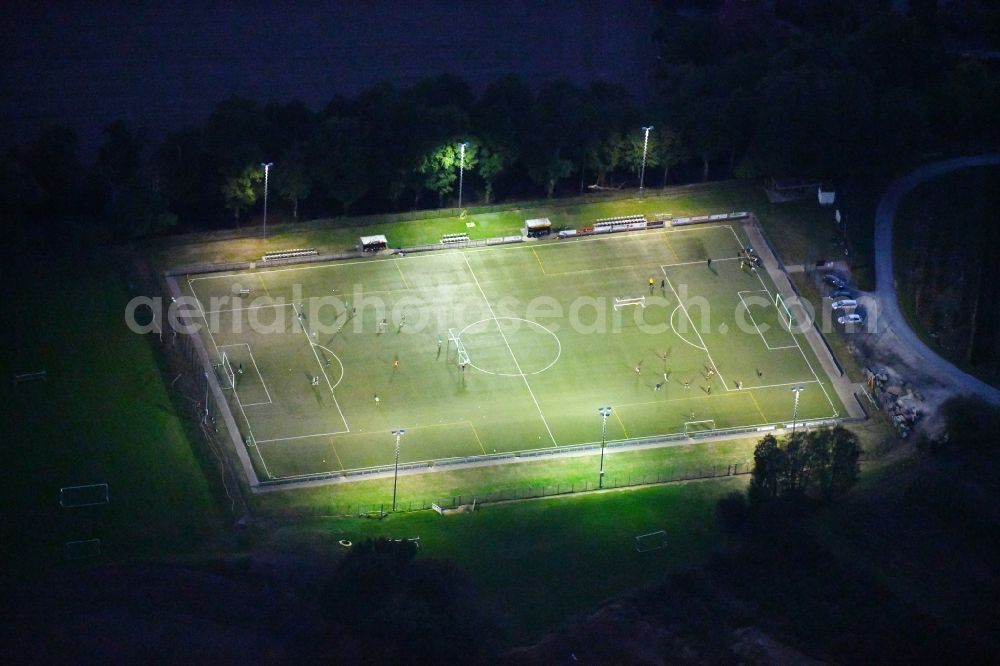 Bad Iburg at night from the bird perspective: Night lighting Sports grounds and football pitch TuS Glane 1929 e.V. in Bad Iburg in the state Lower Saxony, Germany