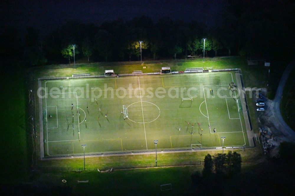 Aerial image at night Bad Iburg - Night lighting Sports grounds and football pitch TuS Glane 1929 e.V. in Bad Iburg in the state Lower Saxony, Germany