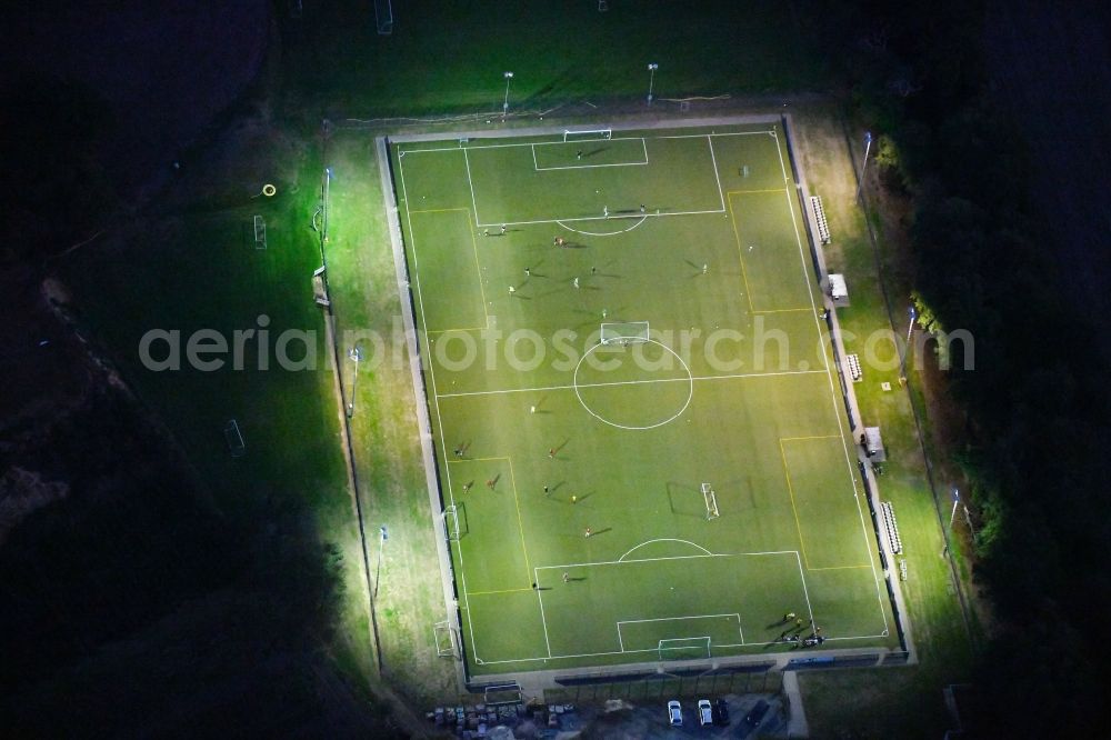 Bad Iburg at night from the bird perspective: Night lighting Sports grounds and football pitch TuS Glane 1929 e.V. in Bad Iburg in the state Lower Saxony, Germany