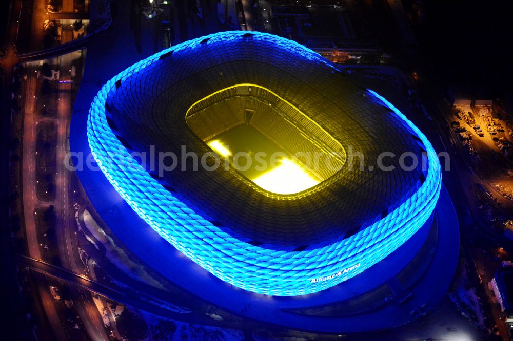 München at night from above - Night lighting sports facility grounds of the Arena stadium Allianz Arena on Werner-Heisenberg-Allee in Munich in the state Bavaria, Germany