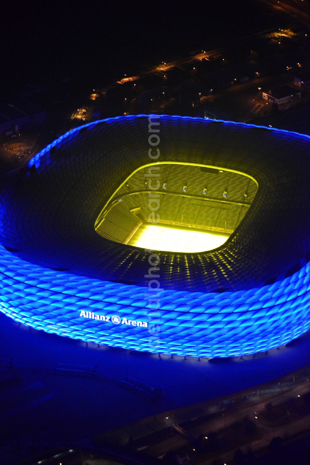 München at night from above - Night lighting sports facility grounds of the Arena stadium Allianz Arena on Werner-Heisenberg-Allee in Munich in the state Bavaria, Germany