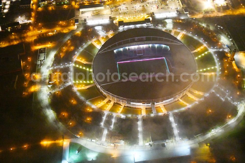 Aerial image at night Leipzig - Night lighting Sports facility grounds of the Arena stadium Red Bull Arena Am Sportforum in Leipzig in the state Saxony