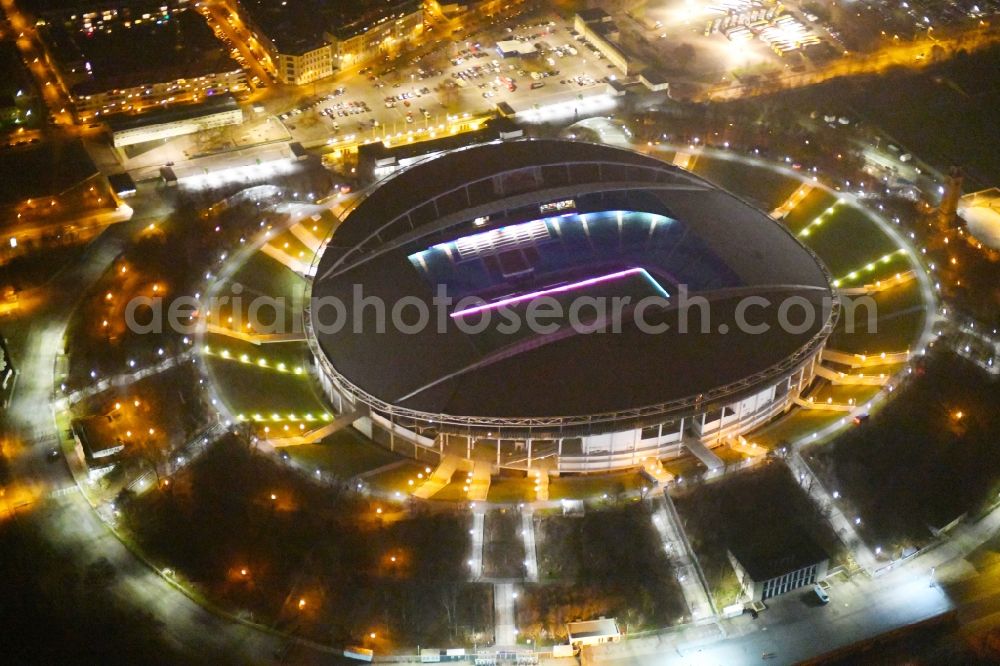 Leipzig at night from the bird perspective: Night lighting Sports facility grounds of the Arena stadium Red Bull Arena Am Sportforum in Leipzig in the state Saxony