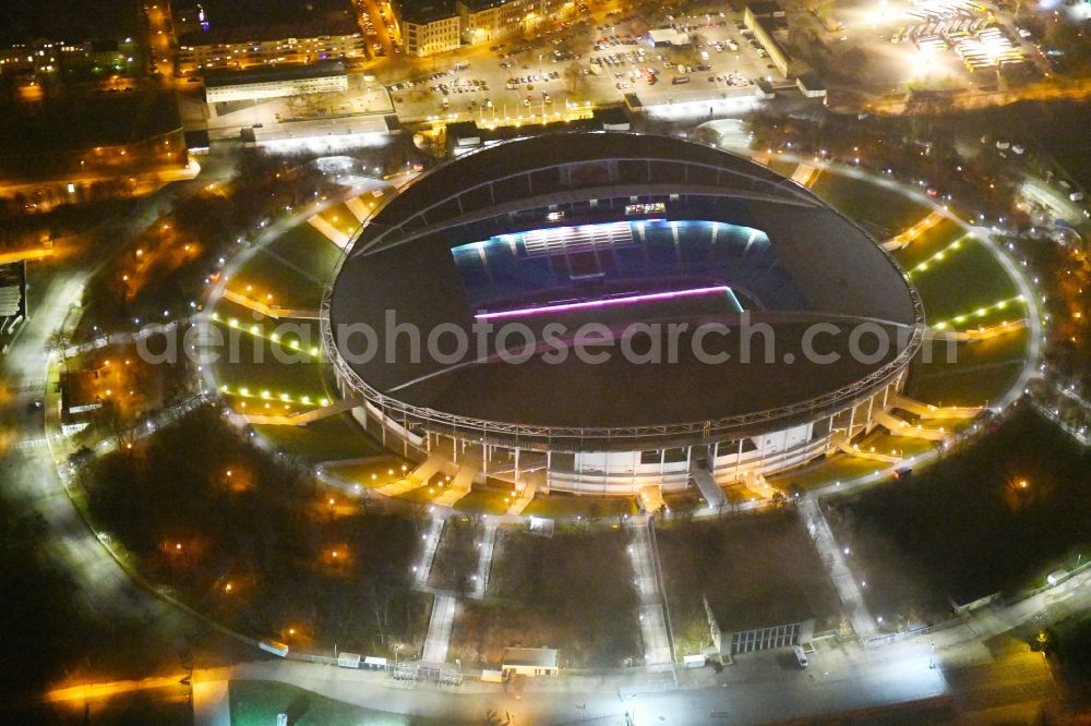 Aerial image at night Leipzig - Night lighting Sports facility grounds of the Arena stadium Red Bull Arena Am Sportforum in Leipzig in the state Saxony