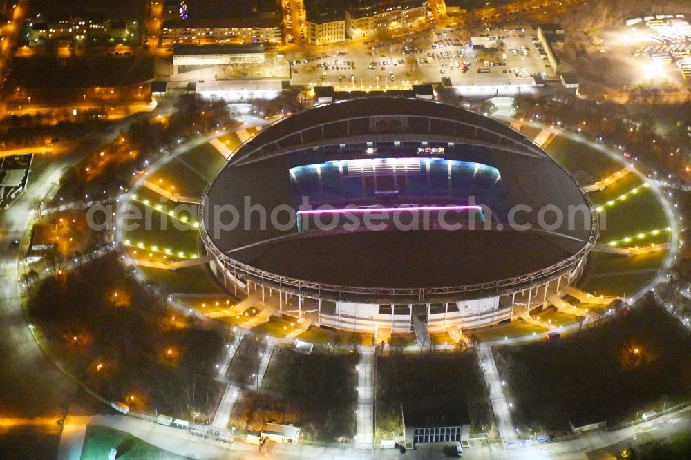 Leipzig at night from above - Night lighting Sports facility grounds of the Arena stadium Red Bull Arena Am Sportforum in Leipzig in the state Saxony