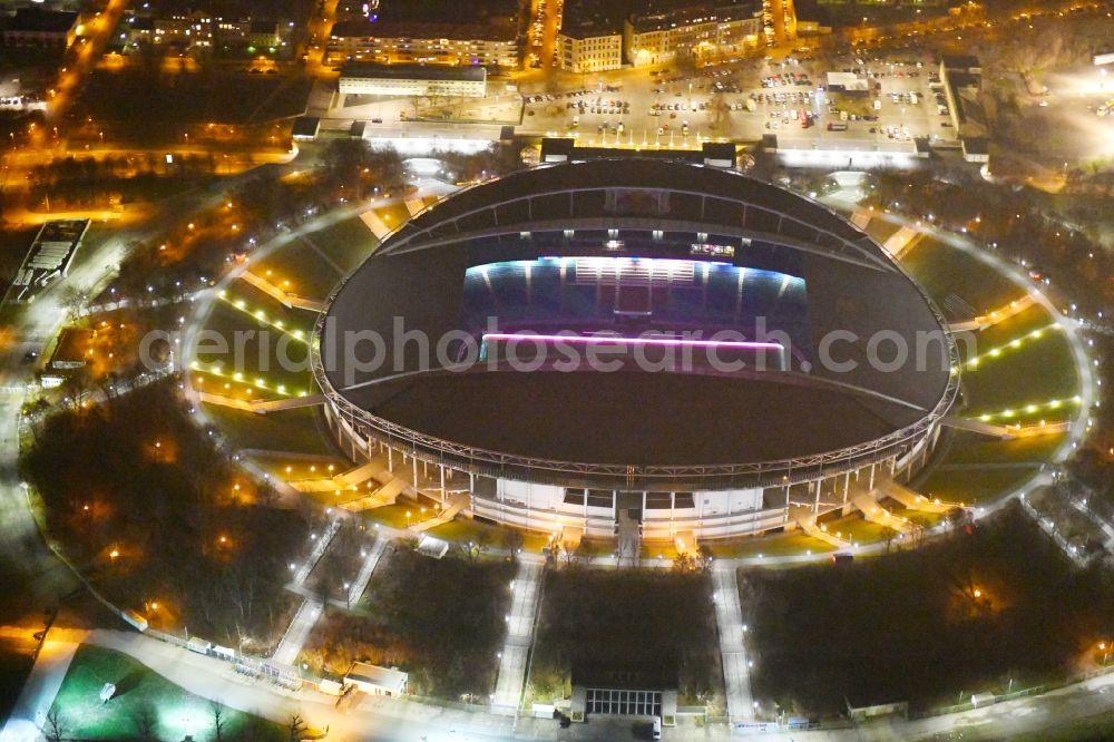 Leipzig at night from the bird perspective: Night lighting Sports facility grounds of the Arena stadium Red Bull Arena Am Sportforum in Leipzig in the state Saxony