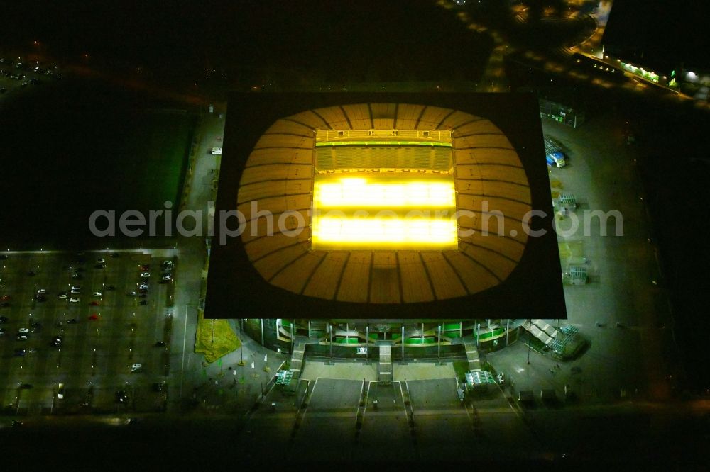 Wolfsburg at night from the bird perspective: Night lighting Sports facility grounds of the Arena stadium Volkswagen Arena In den Allerwiesen in the district Sonderbezirk in Wolfsburg in the state Lower Saxony, Germany