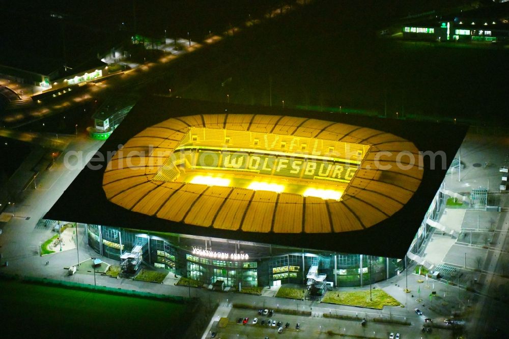 Wolfsburg at night from the bird perspective: Night lighting Sports facility grounds of the Arena stadium Volkswagen Arena In den Allerwiesen in the district Sonderbezirk in Wolfsburg in the state Lower Saxony, Germany