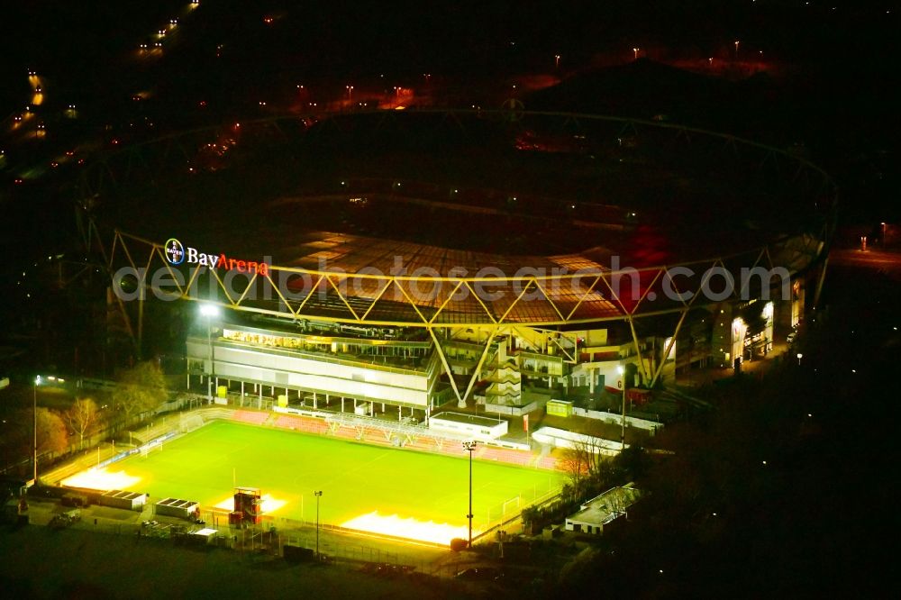 Leverkusen at night from above - Night lighting sports facility grounds of the Arena stadium BayArena on Bismarckstrasse in Leverkusen in the state North Rhine-Westphalia