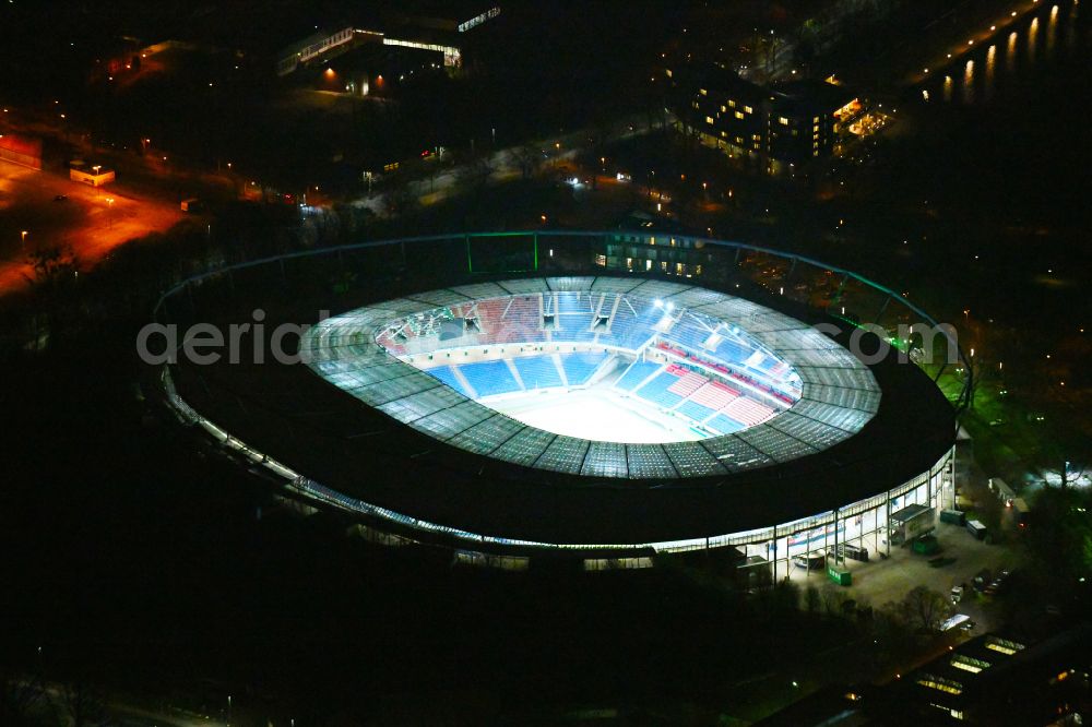 Hannover at night from the bird perspective: Night lighting Stadium of the Heinz von Heiden Arena (formerly AWD Arena and HDI Arena) on Robert-Enke-Strasse in the Calenberger Neustadt district of Hanover in Lower Saxony