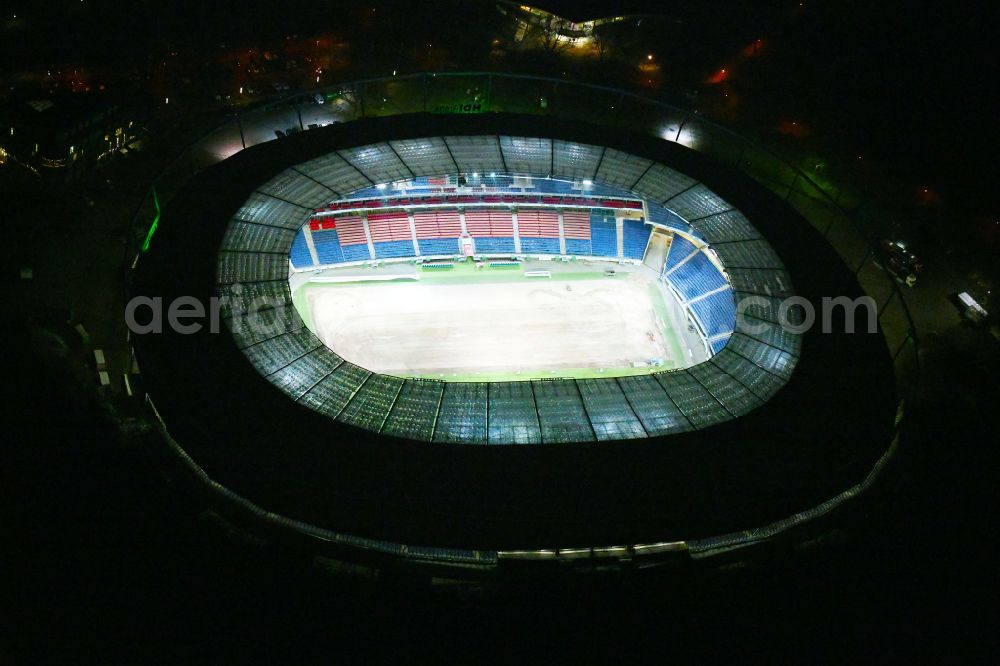 Hannover at night from above - Night lighting Stadium of the Heinz von Heiden Arena (formerly AWD Arena and HDI Arena) on Robert-Enke-Strasse in the Calenberger Neustadt district of Hanover in Lower Saxony