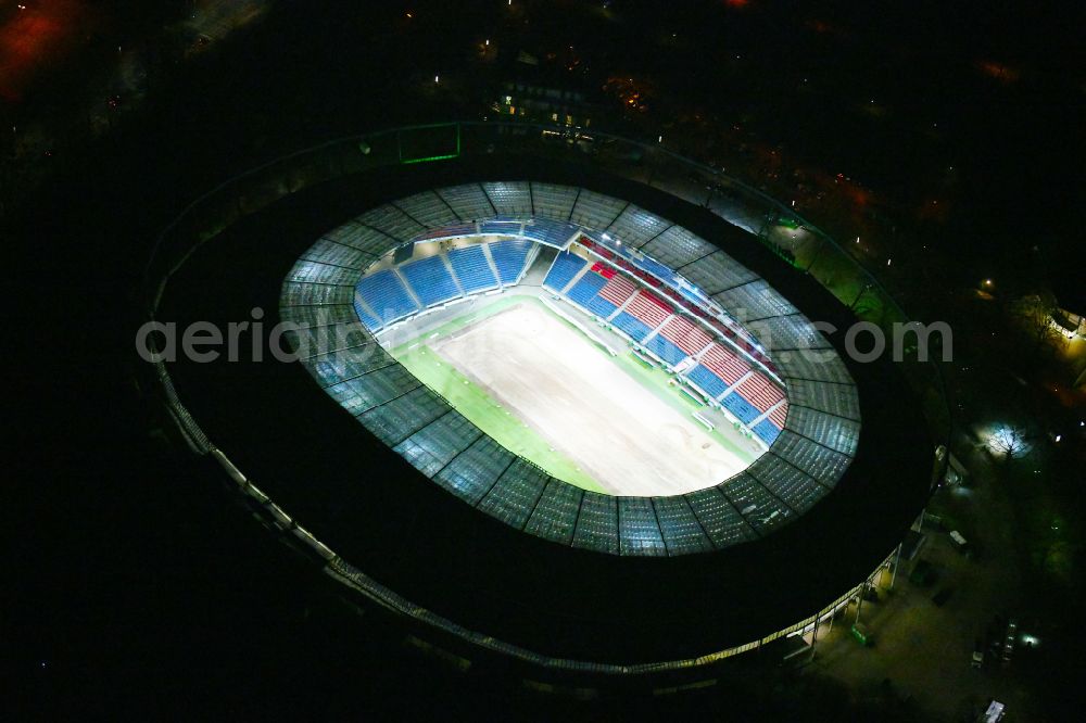 Aerial photograph at night Hannover - Night lighting Stadium of the Heinz von Heiden Arena (formerly AWD Arena and HDI Arena) on Robert-Enke-Strasse in the Calenberger Neustadt district of Hanover in Lower Saxony