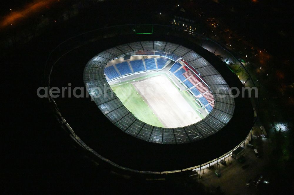 Aerial image at night Hannover - Night lighting Stadium of the Heinz von Heiden Arena (formerly AWD Arena and HDI Arena) on Robert-Enke-Strasse in the Calenberger Neustadt district of Hanover in Lower Saxony