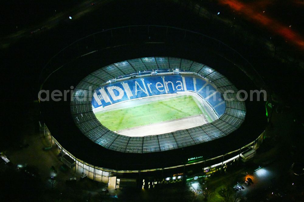 Aerial image at night Hannover - Night lighting Stadium of the Heinz von Heiden Arena (formerly AWD Arena and HDI Arena) on Robert-Enke-Strasse in the Calenberger Neustadt district of Hanover in Lower Saxony