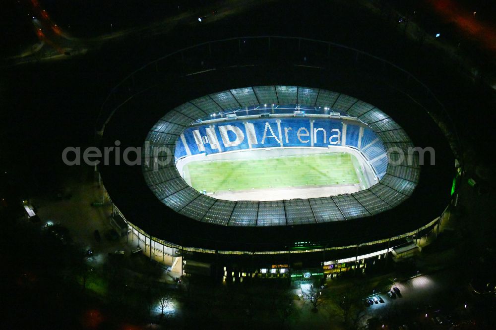 Hannover at night from above - Night lighting Stadium of the Heinz von Heiden Arena (formerly AWD Arena and HDI Arena) on Robert-Enke-Strasse in the Calenberger Neustadt district of Hanover in Lower Saxony