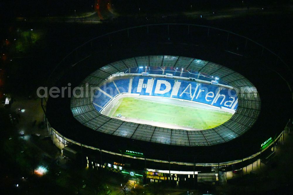 Aerial photograph at night Hannover - Night lighting Stadium of the Heinz von Heiden Arena (formerly AWD Arena and HDI Arena) on Robert-Enke-Strasse in the Calenberger Neustadt district of Hanover in Lower Saxony