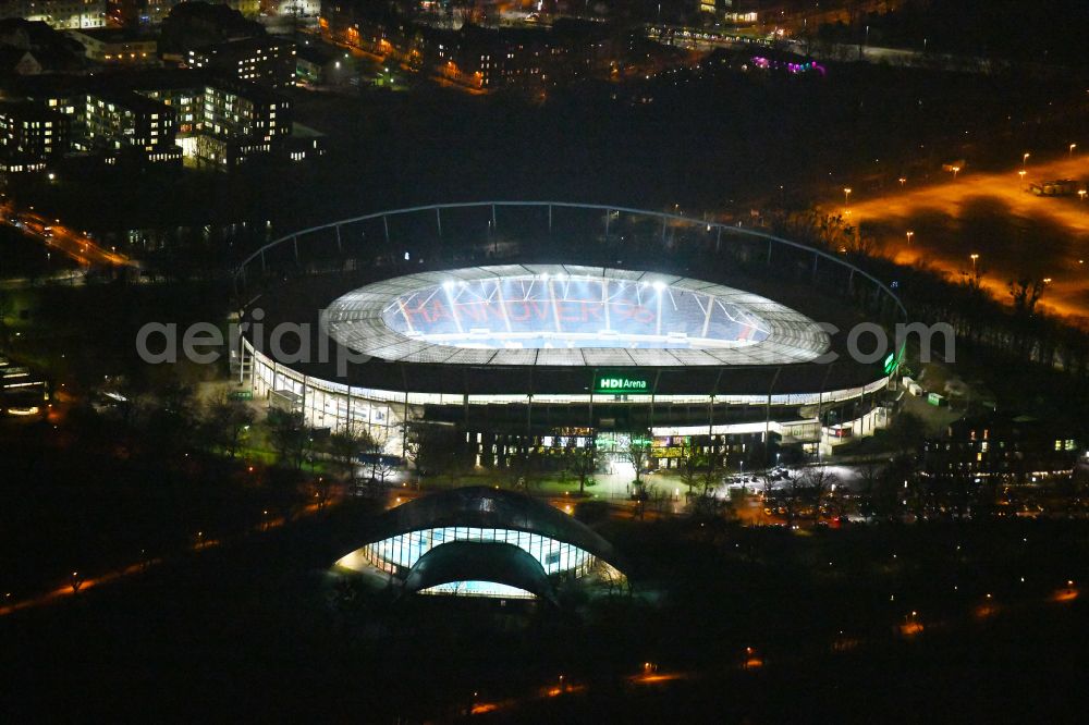 Aerial photograph at night Hannover - Night lighting Stadium of the Heinz von Heiden Arena (formerly AWD Arena and HDI Arena) on Robert-Enke-Strasse in the Calenberger Neustadt district of Hanover in Lower Saxony