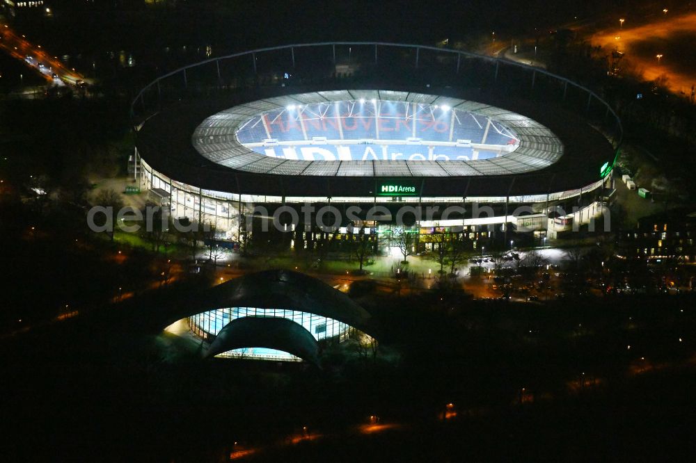 Aerial image at night Hannover - Night lighting Stadium of the Heinz von Heiden Arena (formerly AWD Arena and HDI Arena) on Robert-Enke-Strasse in the Calenberger Neustadt district of Hanover in Lower Saxony