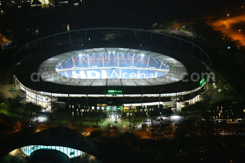 Hannover at night from above - Night lighting Stadium of the Heinz von Heiden Arena (formerly AWD Arena and HDI Arena) on Robert-Enke-Strasse in the Calenberger Neustadt district of Hanover in Lower Saxony