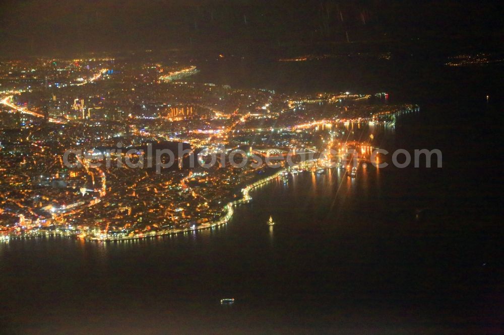 Aerial photograph at night Istanbul - Night lighting district of the Asian part of Istanbul at the eastern shore of the Bosporus district Ueskuedar in Istanbul in Turkey