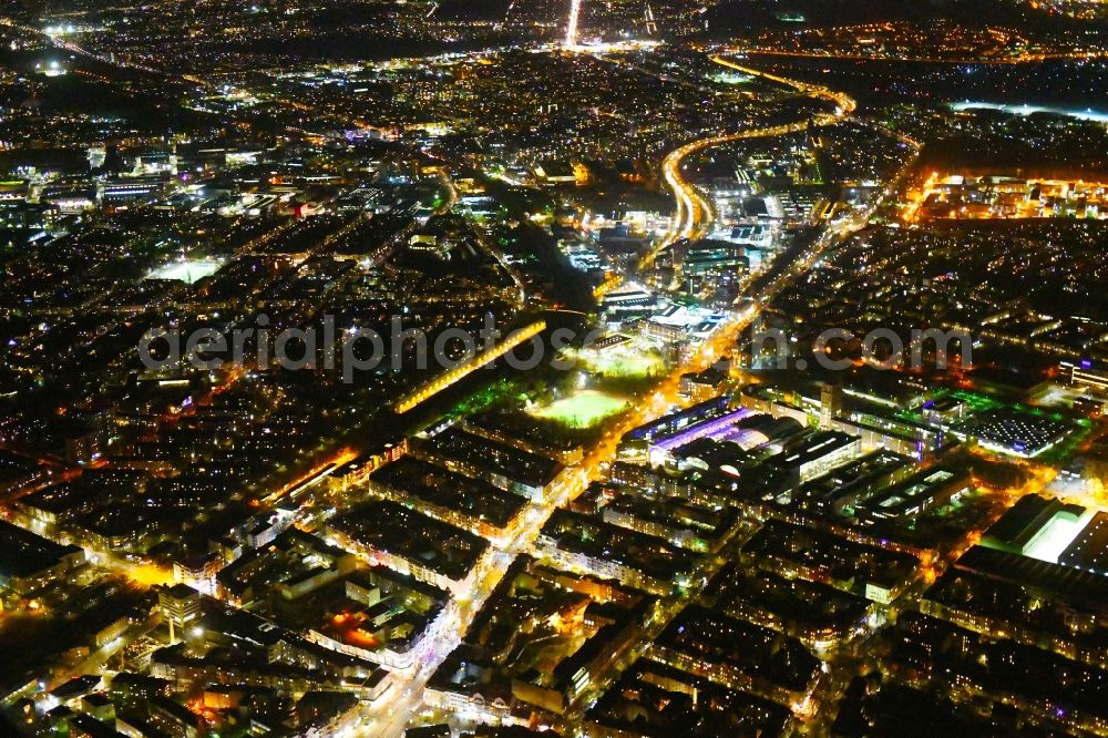 Berlin at night from the bird perspective: Night lighting District along the Karolinenstrasse - Berliner Strasse in the city in the district Reinickendorf in Berlin, Germany