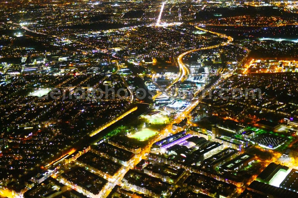 Aerial photograph at night Berlin - Night lighting District along the Karolinenstrasse - Berliner Strasse in the city in the district Reinickendorf in Berlin, Germany