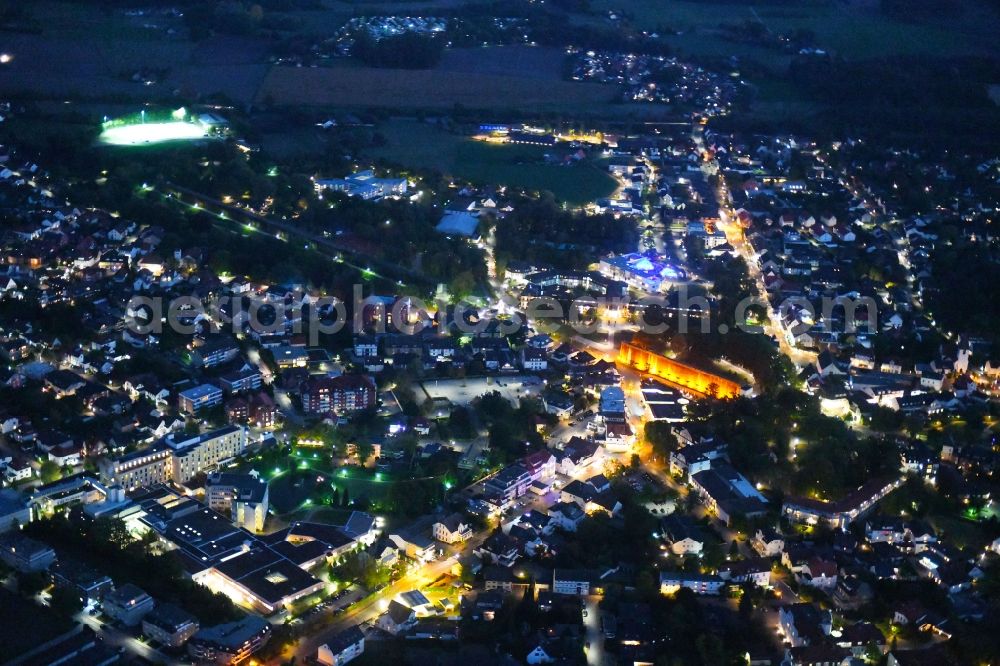 Aerial image at night Bad Rothenfelde - Night lighting City view of the city area of in Bad Rothenfelde in the state Lower Saxony, Germany