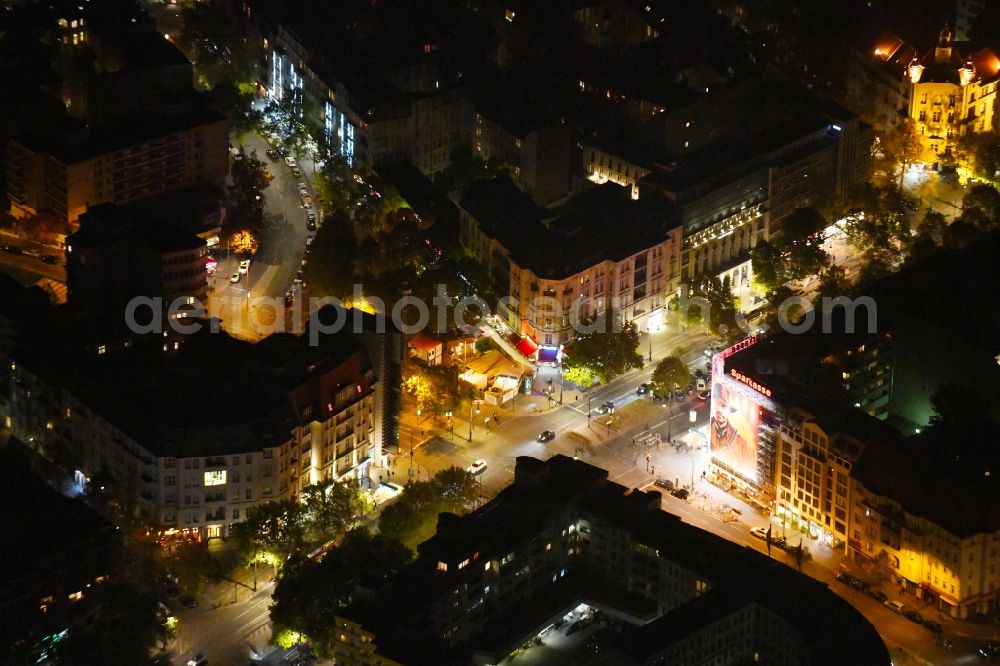 Aerial image at night Berlin - Night lighting City view of downtown area on Adenauer Platz in the district Charlottenburg in Berlin, Germany