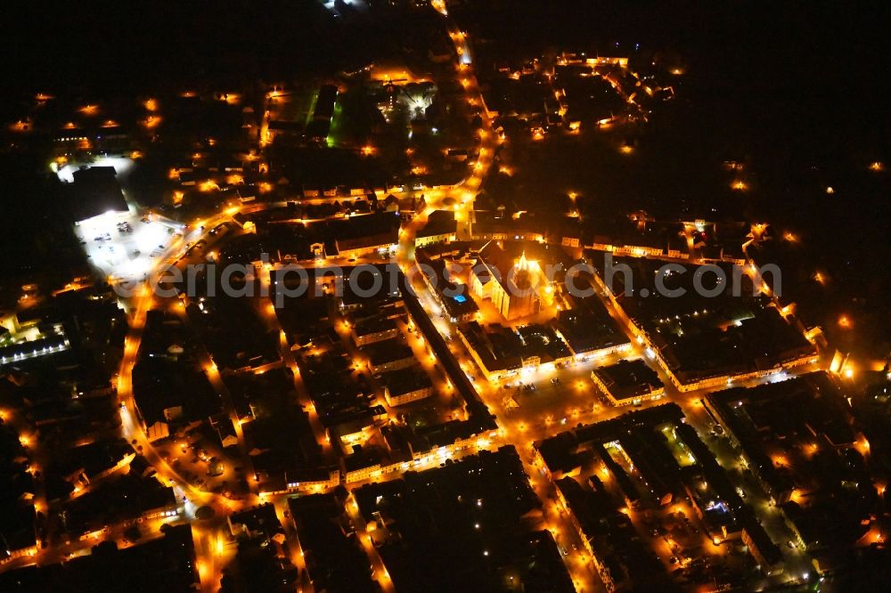 Aerial image at night Beeskow - Night lighting City view of downtown area in Beeskow in the state Brandenburg, Germany