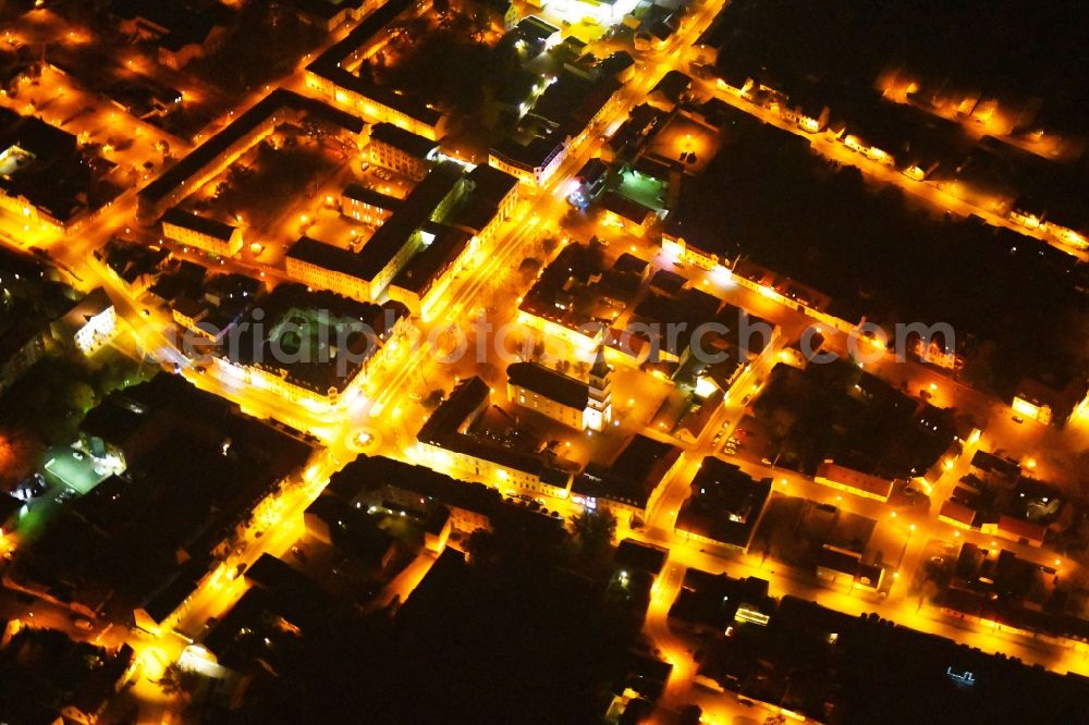 Aerial image at night Seelow - Night lighting City view of downtown area in Seelow in the state Brandenburg, Germany