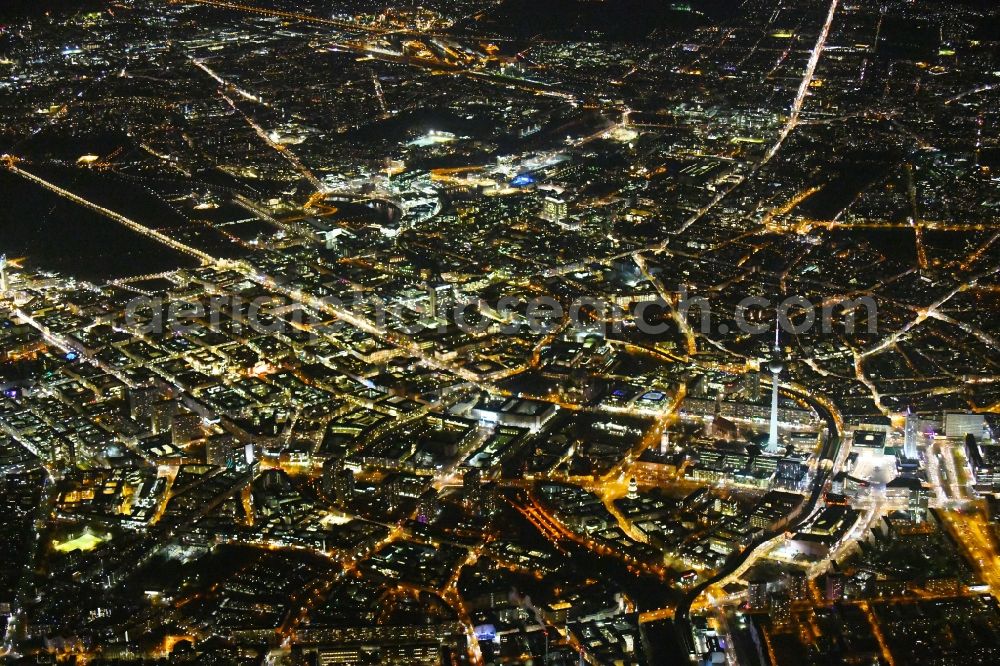 Aerial image at night Berlin - Night lighting City view of downtown area Unter den Linden - Leipziger Strasse - Rathausstrasse in the district Mitte in Berlin, Germany