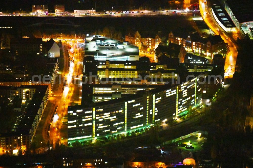 Berlin at night from the bird perspective: Night lighting City view of downtown area Victoriastadt along the Schreiberhauer Strasse in Berlin, Germany