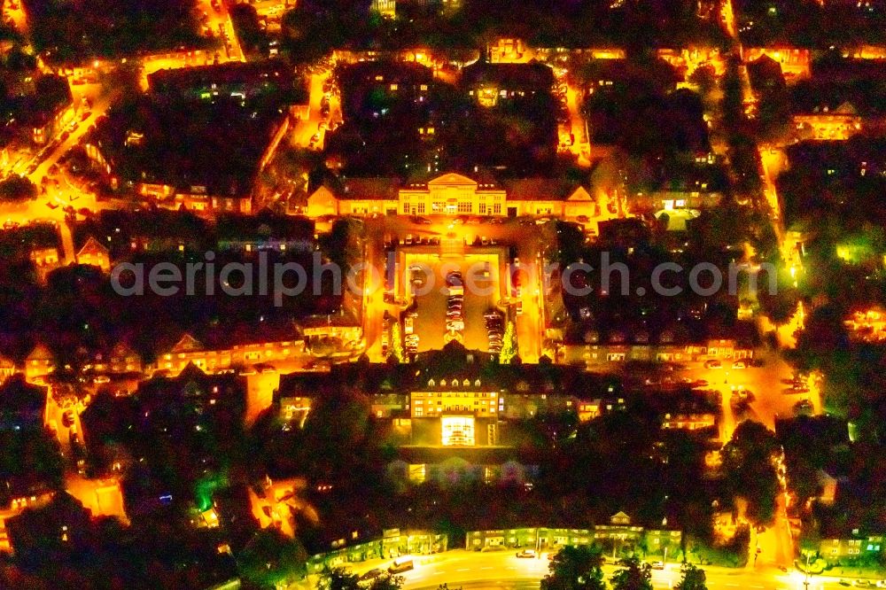 Aerial photograph at night Essen - Night lighting city view near the little market with a branch of the Edeka supermarket in Essen in the state North Rhine-Westphalia