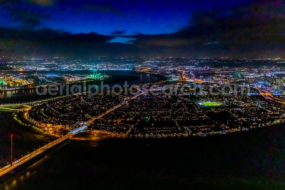 Aerial photograph at night Düsseldorf - Night lighting district of Oberkassel and Niederkassel at the Oberkasseler Bruecke in the city in Duesseldorf in the state North Rhine-Westphalia, Germany