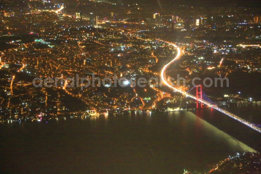 Aerial photograph at night Istanbul - Night lighting city view on the Bosporus with Bosporus Bridge looking to the Asian part of Istanbul in Turkey