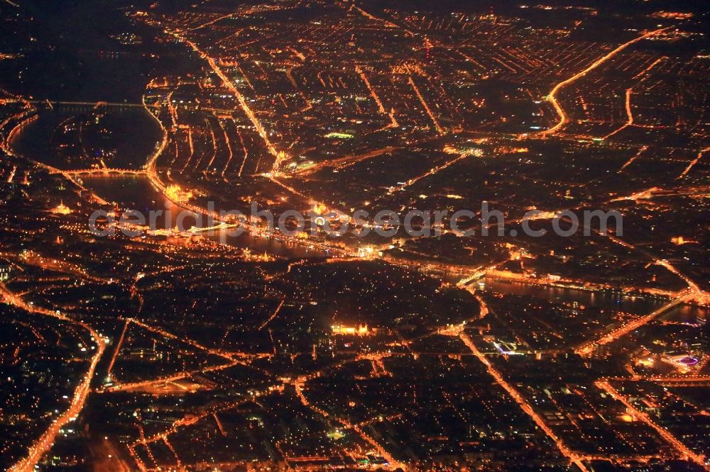 Budapest at night from the bird perspective: Night lighting city view on the river bank of the river Danube in Budapest in Hungary