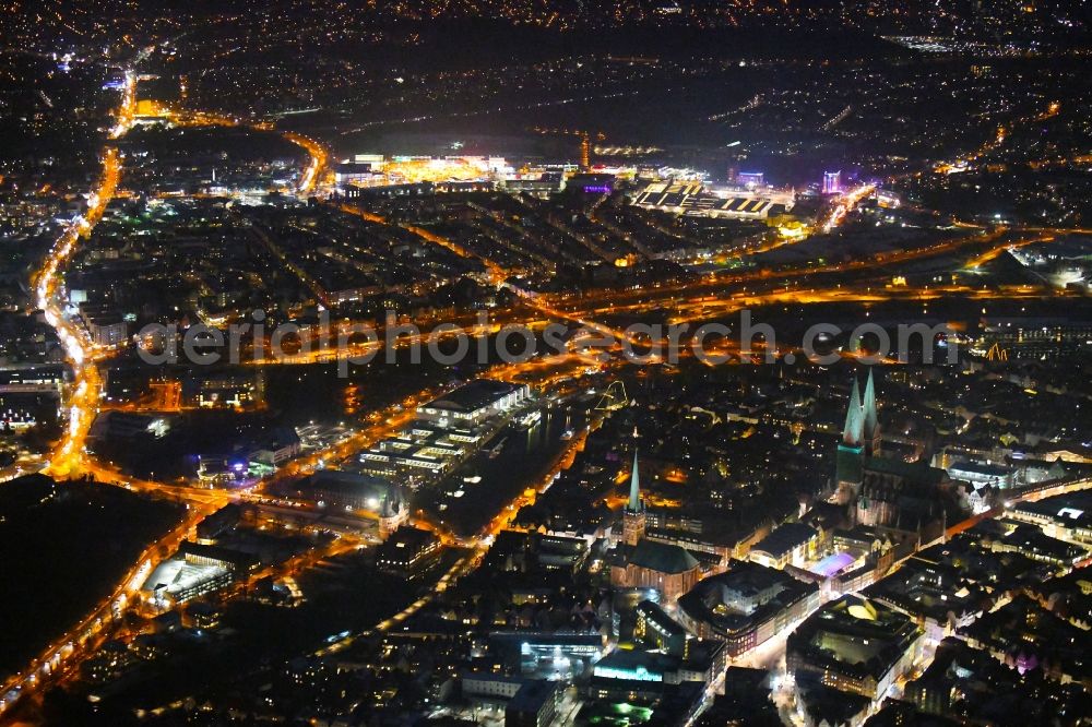 Lübeck at night from the bird perspective: Night lighting city view on the river bank Stadtgraben - Obertrave in the district Innenstadt in Luebeck in the state Schleswig-Holstein, Germany