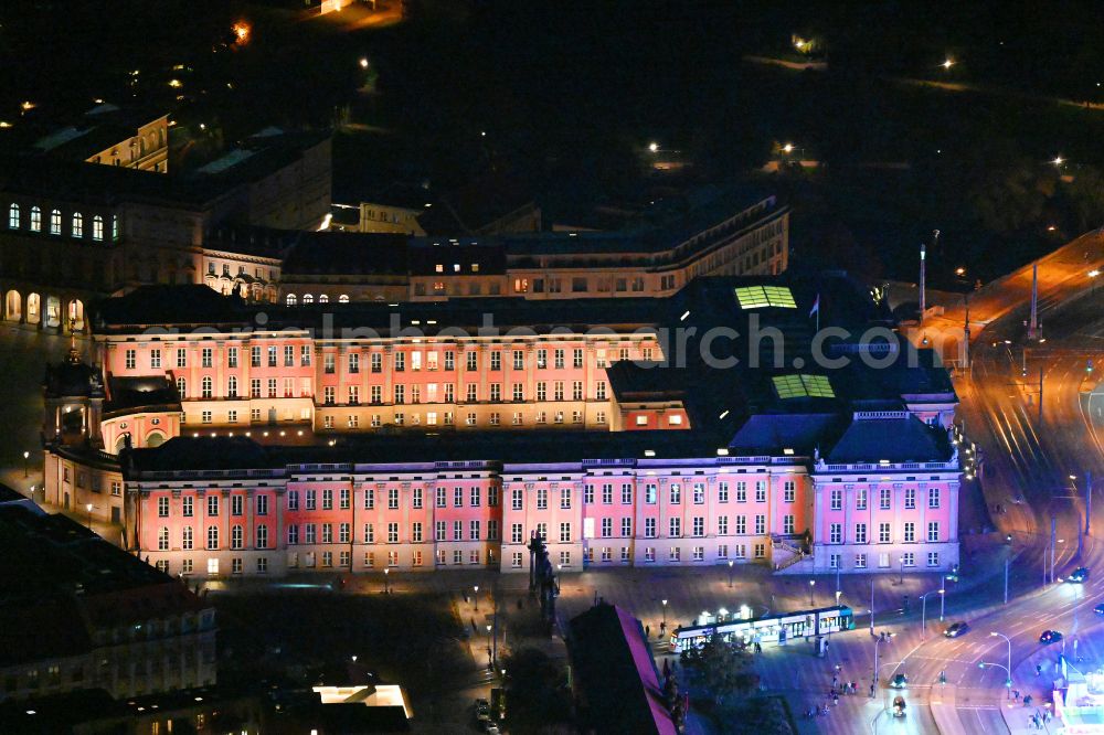 Aerial image at night Potsdam - Night lights and illumination of the city palace and seat of the Brandenburg State Parliament in Potsdam in the federal state of Brandenburg