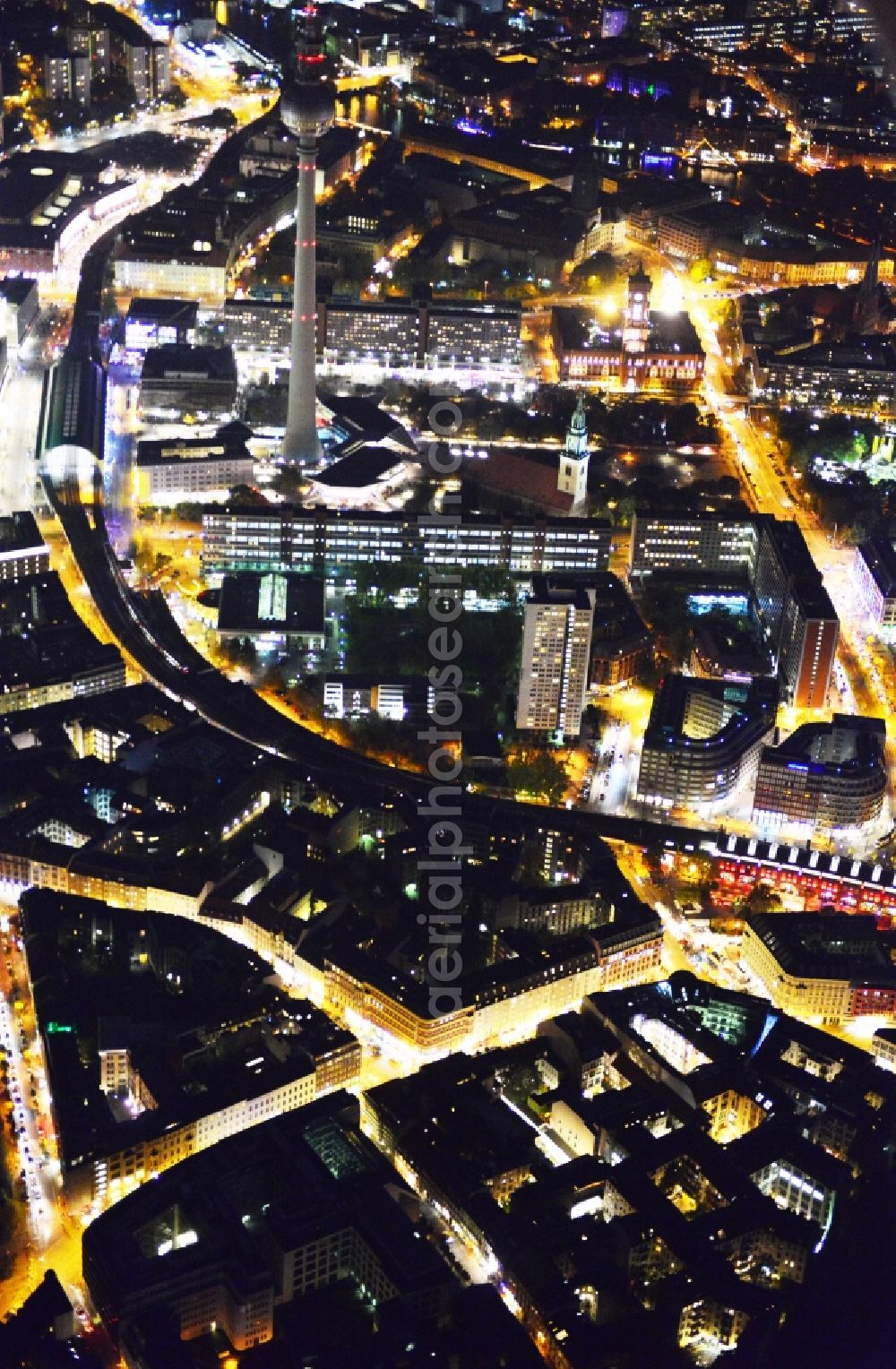 Aerial image at night Berlin - Night aerial view of downtown Berlin-Mitte with a view of the TV tower. View along the suburban railway tracks between Hackescher Markt and Alexanderplatz