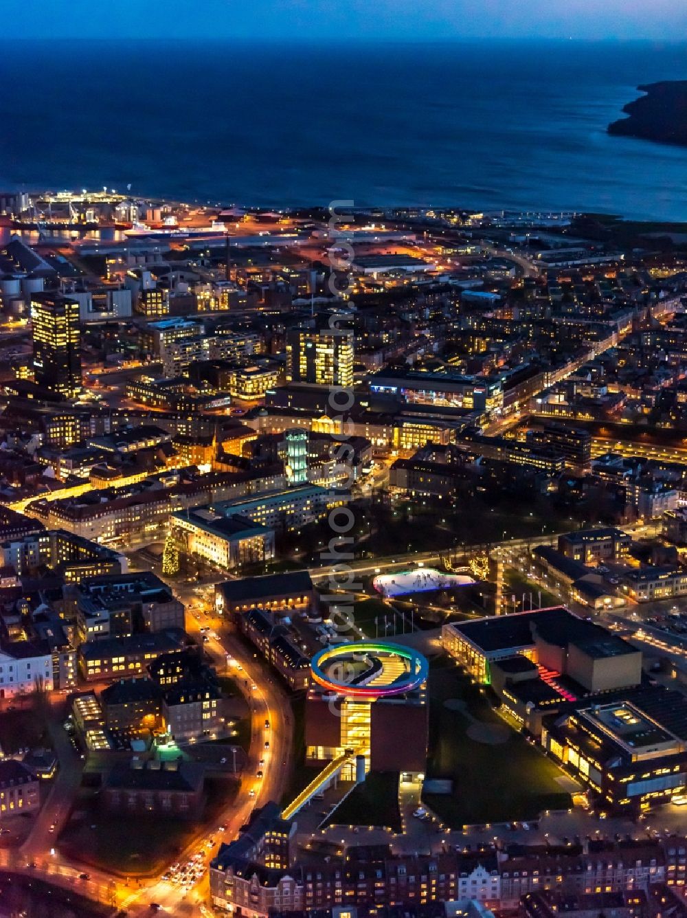 Aarhus at night from the bird perspective: Night lighting the city center in the downtown area in Aarhus in Region Midtjylland, Denmark