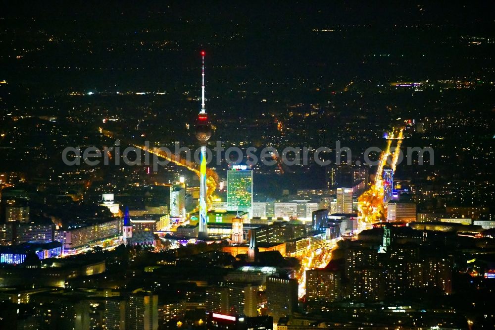 Berlin at night from the bird perspective: Night lighting The city center in the downtown area on Berliner Fernsehturm - Alexanderplatz in Berlin, Germany