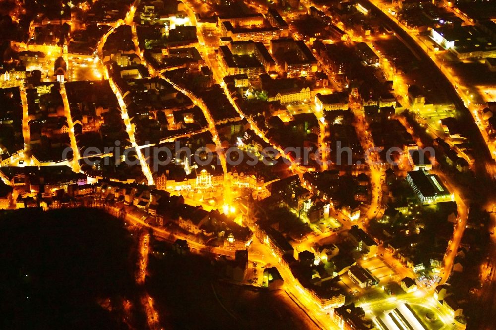 Eisenach at night from the bird perspective: Night lighting the city center in the downtown area in Eisenach in the state Thuringia, Germany